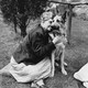 Helen Keller hugs her German Shepherd