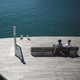 Two people looking at ocean