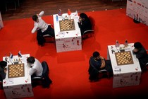 Three games of chess are observed from overhead