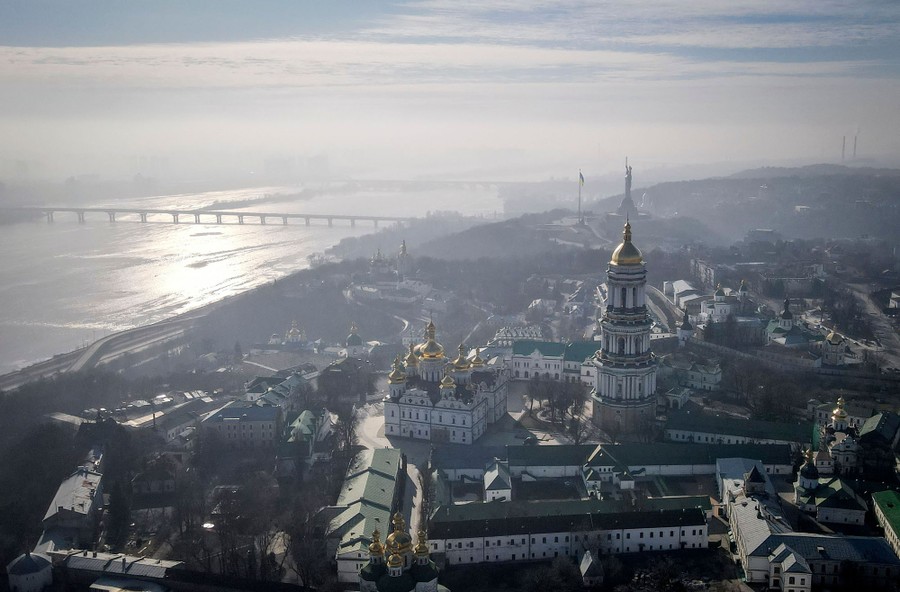 An aerial picture of the city of Kyiv, with smoke hanging in the air.