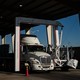 A news photo of a tractor trailer crossing the U.S. border with Mexico.