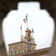 The Italian flag flutters at the Quirinal Palace during the two-day talks on government formation, after the March national elections, in Rome on April 4, 2018