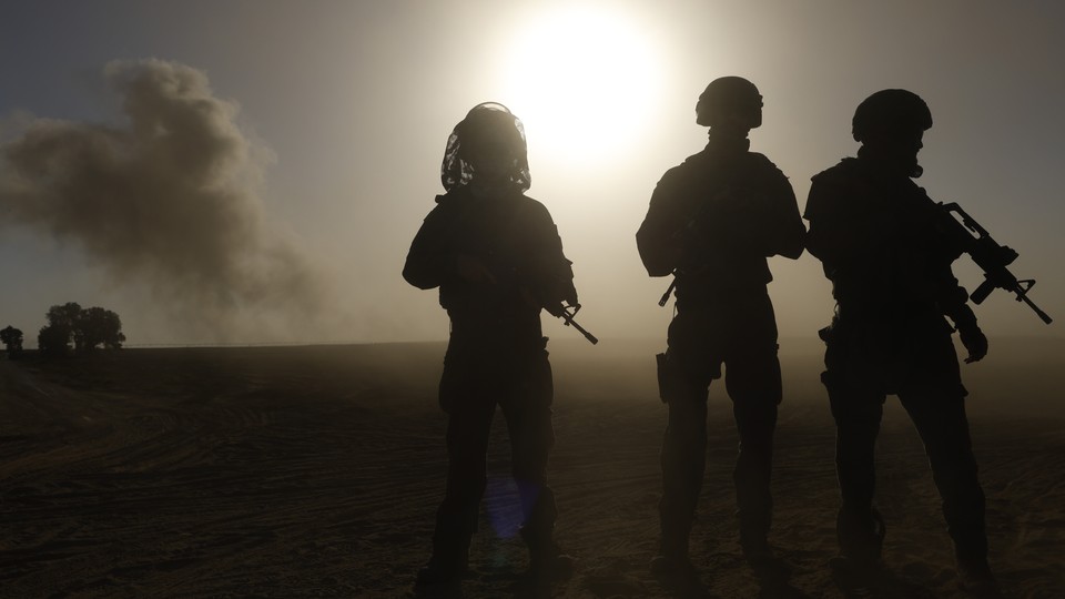Silhouettes of armed soldiers in contralux