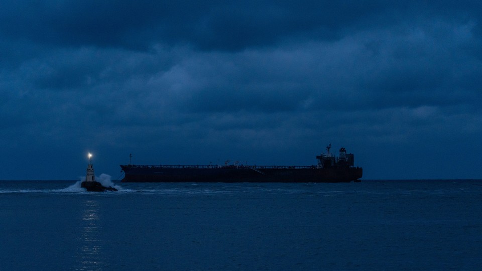 An oil tanker at night