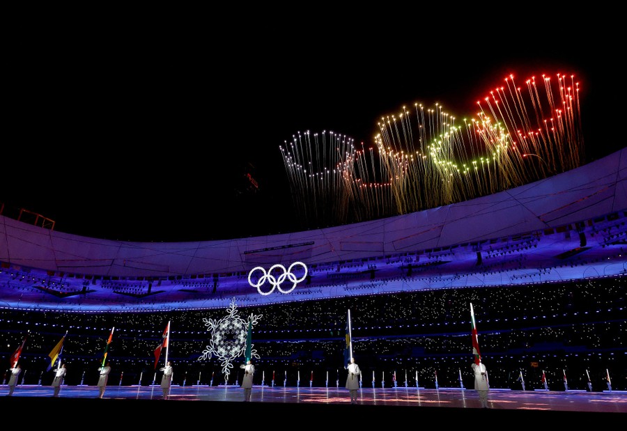 A firework display is seen from inside a stadium.