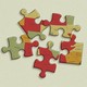 Messy jigsaw puzzle pieces, each showing a small part of the United States map