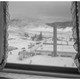 A window overlooking snowy hills