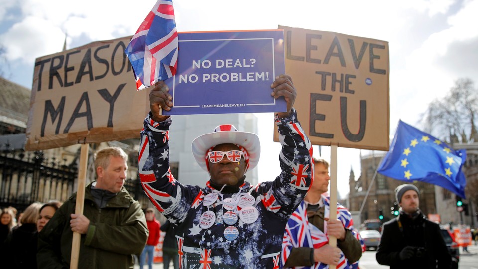Protesters outside the Houses of Parliament, ahead of a Brexit vote in London on March 13, 2019