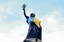 A photo of a statue wearing blue and yellow to represent Ukraine