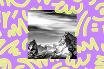 Black and white picture of mountain range with a purple background and yellow doodles