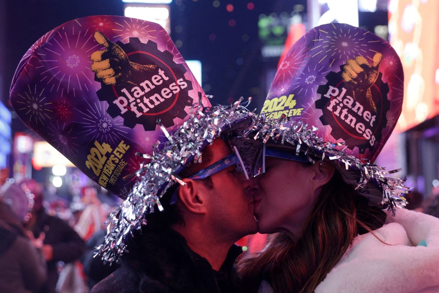 A couple kiss after the clock strikes midnight in Times Square.