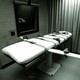 A photograph of a bed in an execution chamber.