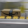 An Amazon prime package on a conveyor belt