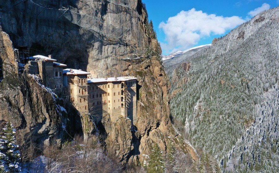 An ancient monastery carved into a huge cliff