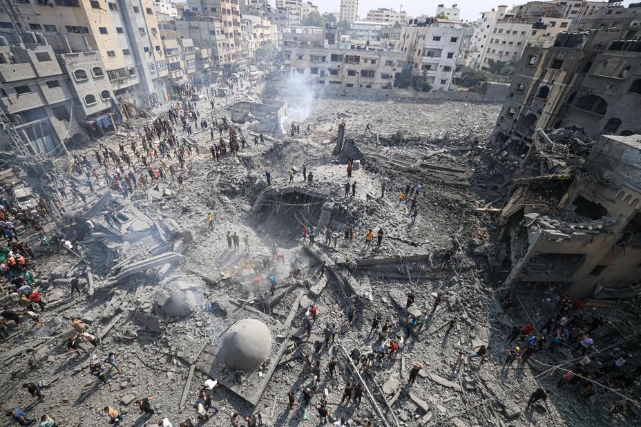 Pictture of Palestinians inspecting the damage following an Israeli airstrike on the Sousi mosque in Gaza City on October 9, 2023. Israel continued to battle Hamas fighters on October 9 and massed tens of thousands of troops and heavy armour around the Gaza Strip after vowing a massive blow over the Palestinian militants' surprise attack. (Photo by Mahmud HAMS / AFP) (Photo by MAHMUD HAMS/AFP via Getty Images)
