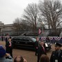 President Trump's limousine passes an empty reviewing stand during the inaugural parade.