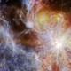 A bright young star within a colorful cloud-like nebula. The star is the brightest spot, dominating the right side of the image, surrounded by six large spokes of light that cross the image.