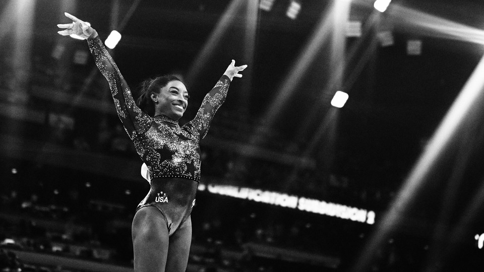 simone biles smiles triumphantly