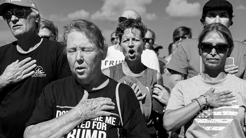 Black and white photo of Trump rally attendees