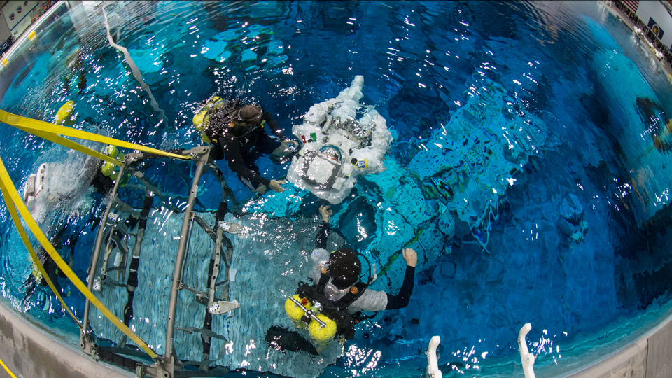 An astronaut in the pool at NASA’s Neutral Buoyancy Lab