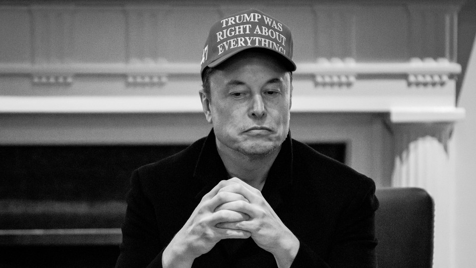 A photo of Elon Musk sitting in a Cabinet meeting, wearing a hat that reads: "Trump was right about everything."
