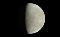 An image of Europa, Jupiter's icy moon, with one half illuminated