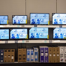 A photograph of rows of televisions in a Best Buy