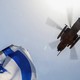 Israeli flag and helicopter flying over blue sky