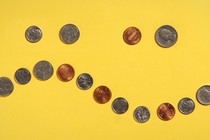 An image of coins arranged in a wave pattern