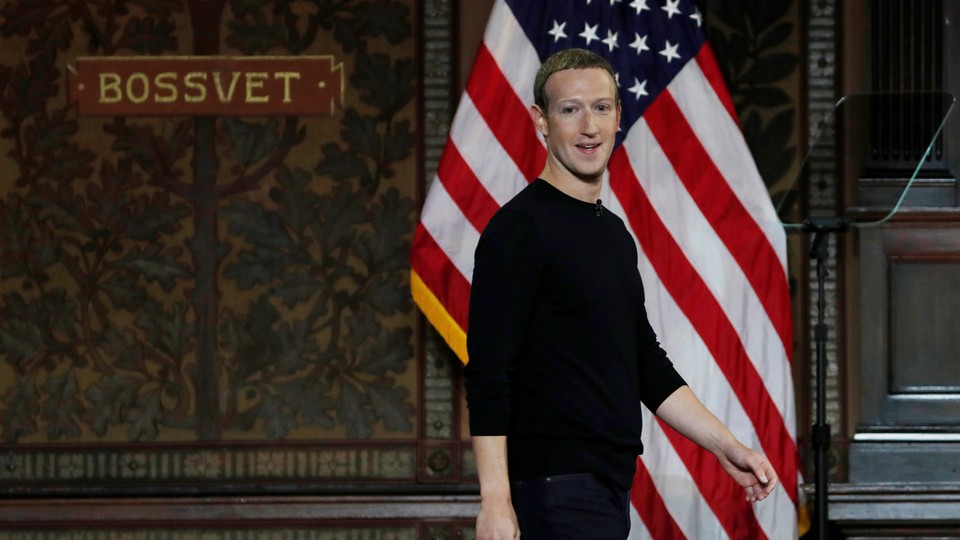 Mark Zuckerberg in front of an American flag at Georgetown University