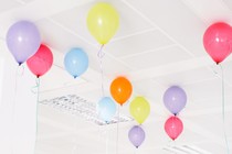 An image of balloons in an office.