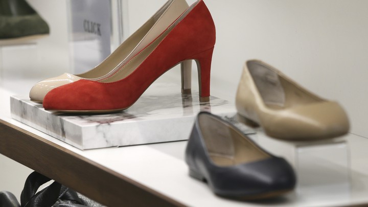 A pair of red heels and women's flats