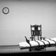 A black-and-white photo of a gurney in an execution room
