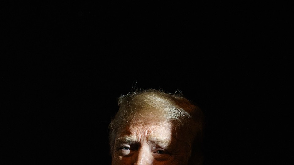 Trump obscured in shadow