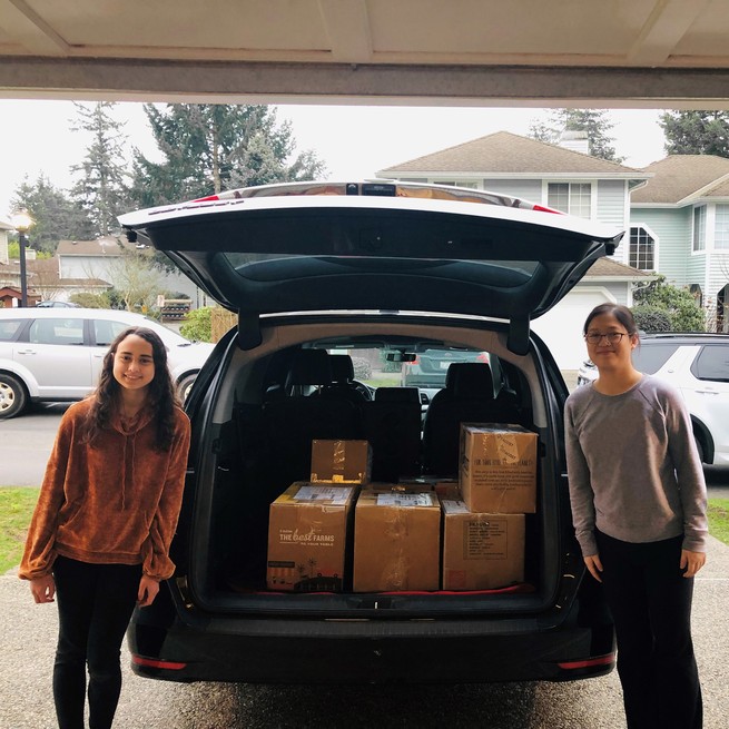 Sabine Wood and Andrea Liao collecting books for their African Library Project. 