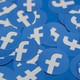 A pile of stickers bearing the Facebook logo