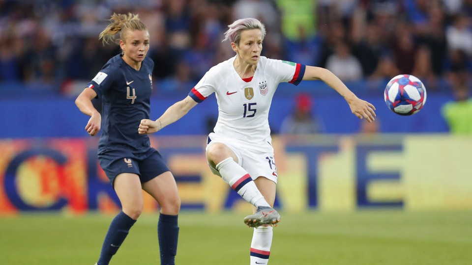 United States forward Megan Rapinoe (15) controls the ball ahead of France defender Marion Torrent (4) in the first half of a quarterfinal match in the FIFA Women's World Cup France 2019