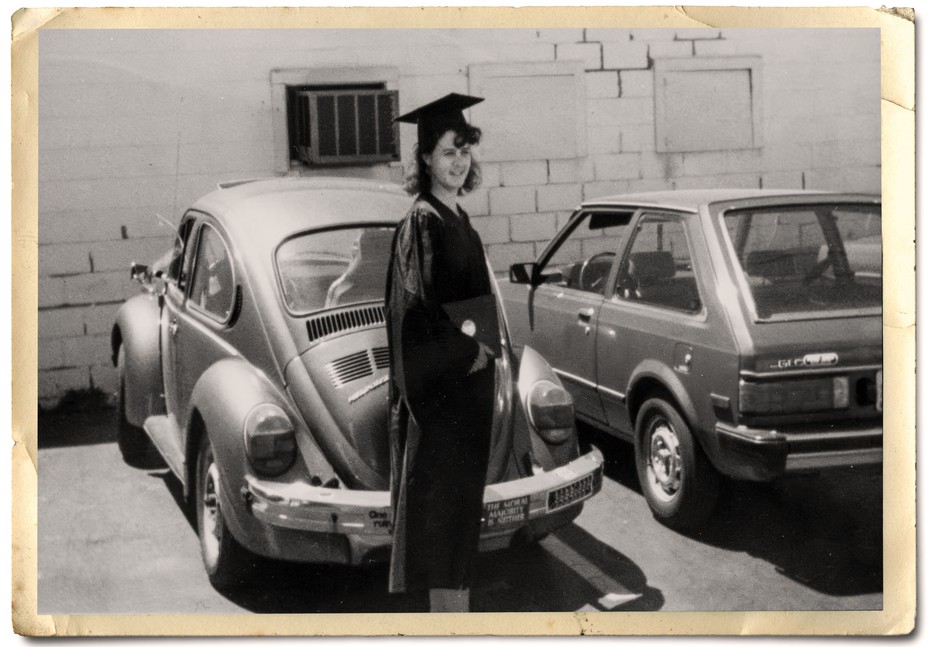 Beth in her graduation gown and hat