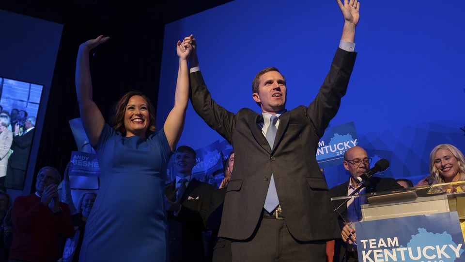 Andy Beshear celebrates his apparent win in Kentucky's governor's race on Tuesday night.
