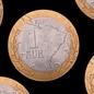 An illustration featuring coins mocked up as el sur