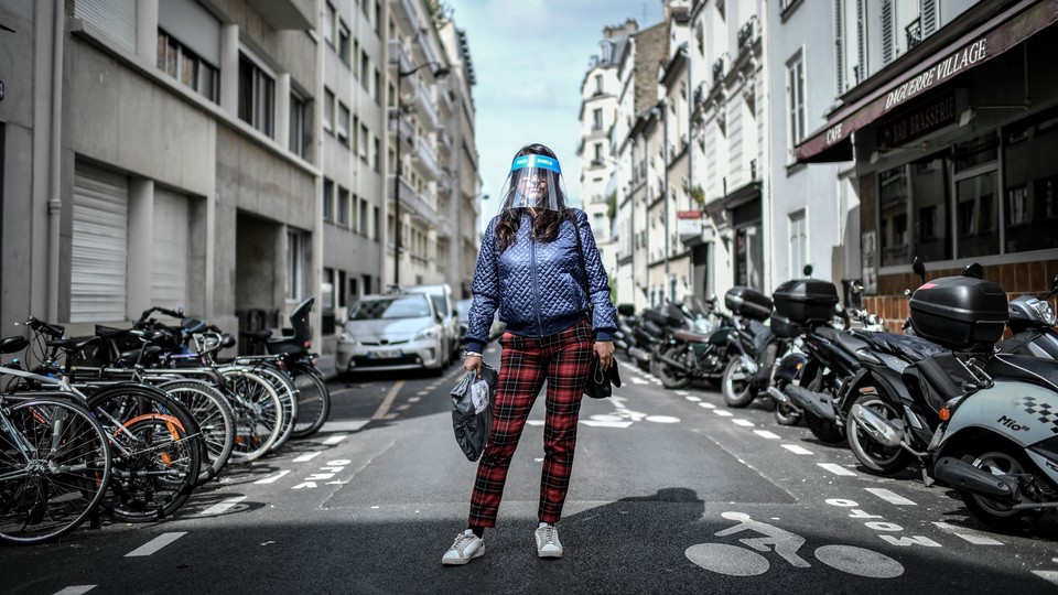 A woman wearing a face shield