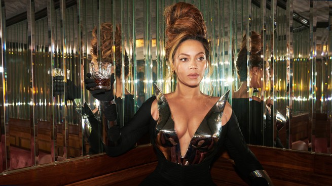 Beyoncé raises a glass in a mirrored room in album art for "Renaissance"