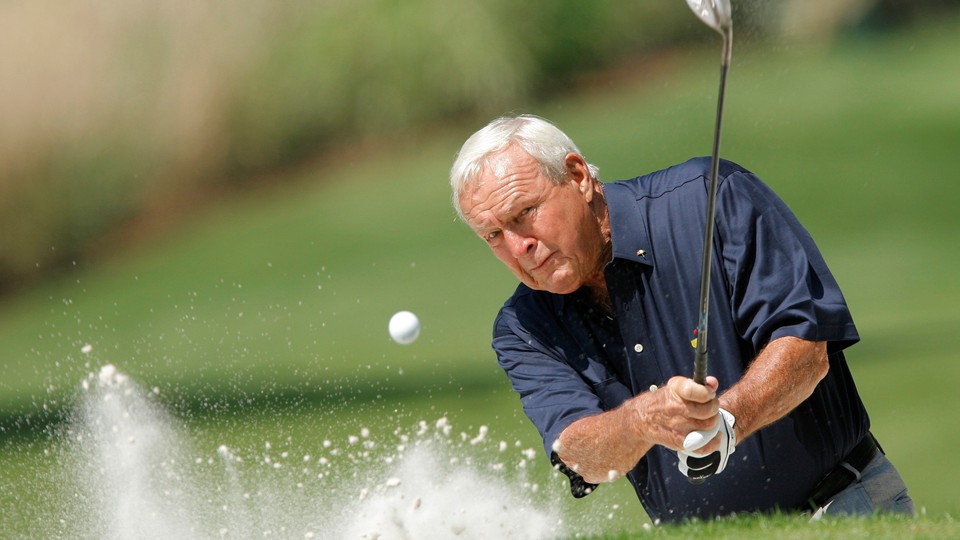 Arnold Palmer hits from a sand trap during the annual Masters Par 3 golf tournament in 2008.