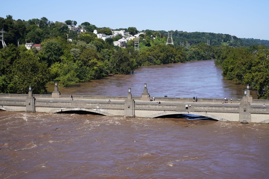 High water is seen rising up to a bridge over the Schuylkill River.