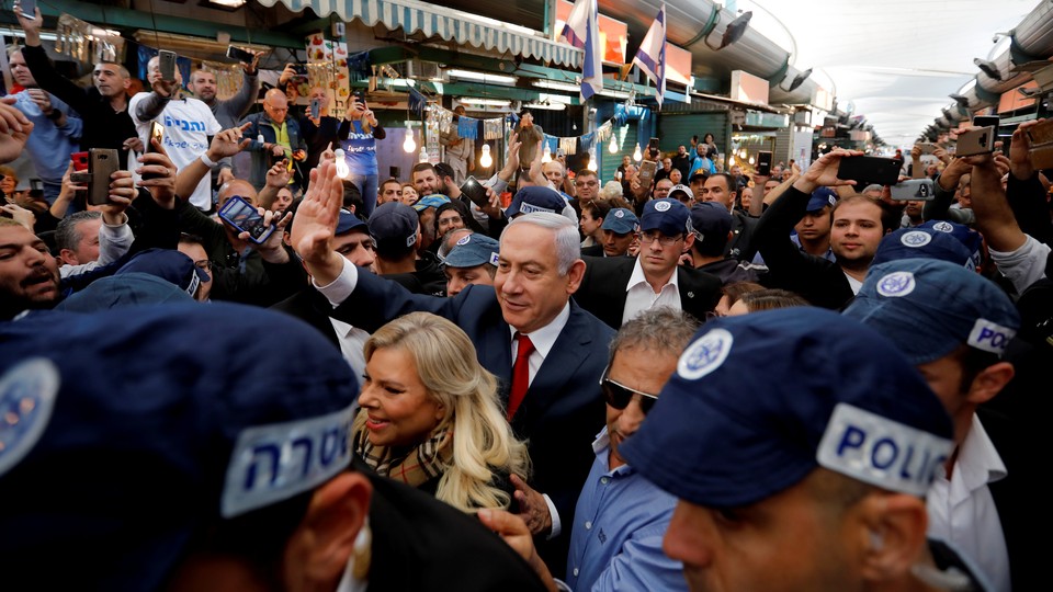 Netanyahu and his wife Sara make a campaign stop at a market in Tel Aviv.