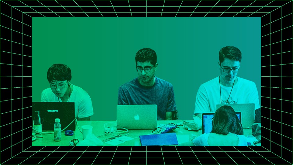 A group of computer science students on their laptops