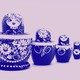 Four nesting dolls with a floral print