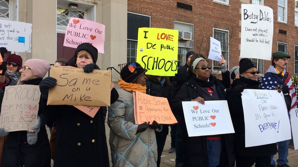 Protesters gather outside D.C.'s Jefferson Middle School on Friday, Feb. 10, 2017, where Education Secretary Betsy DeVos was scheduled to appear.