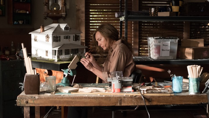Annie Graham (Toni Collette) working in her home studio in the film 'Hereditary.'