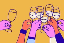 A lone, empty wine glass being raised outside a circle of many full wine glasses